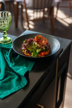 Vegetarian salad with avocado, basil, lettuce and cherry tomatoes. High quality photo