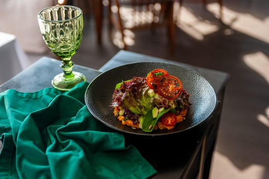 Vegetarian salad with avocado, basil, lettuce and cherry tomatoes. High quality photo