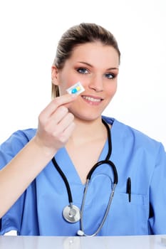 woman doctor holding a pill in hospital