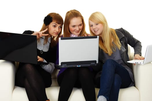 Girls communicate on the Internet with foreigners on sofa