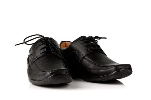 Elegant black leather men&#039 s shoes on white background with shadow.
