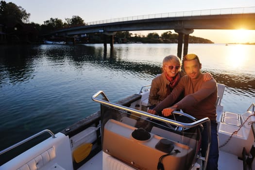 happy young couple in love  have romantic time at summer sunset   at ship boat while  representing urban and countryside fashin lifestyle