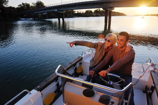 happy young couple in love  have romantic time at summer sunset   at ship boat while  representing urban and countryside fashin lifestyle