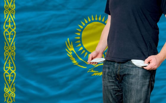 poor man showing empty pockets in front of japan flag