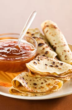 Pancakes with apricot jam close up shoot