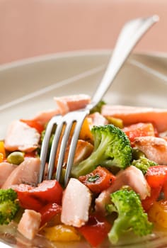 Fresh salmon salad with vegetables close up
