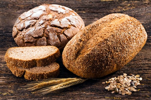 Fresh beautiful bread on wooden background close up shoot