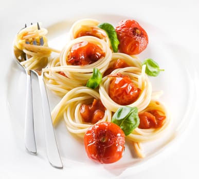 Pasta with tomato sauce and basil close up
