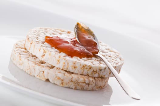 Healthy rice cake with bio jam close up