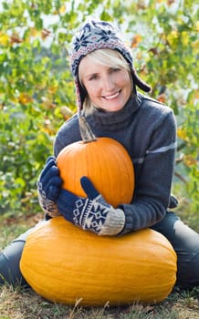 Young woman with orange pumpkin close up shoot