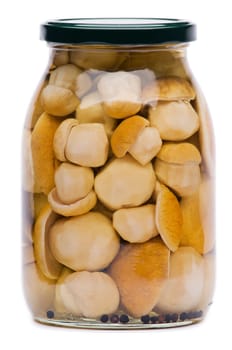 Hole mushrooms in jar isolated on white