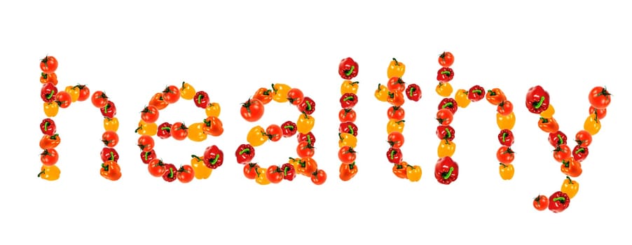 The word healthy written with fresh vegetables, peppers and tomatoes.