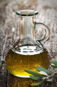 extra virgin olive oil with branch close up