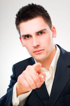 young business man pointing accusing finger close up