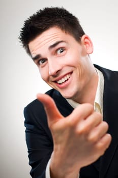 young happy business men showing thumb up
