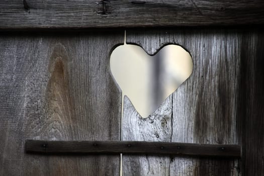 Heart in an old toilet door