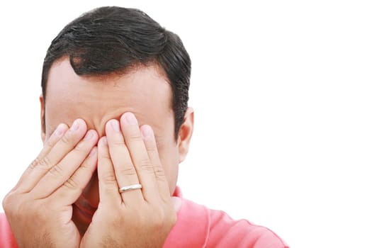 Man frustrated with hands on his face.