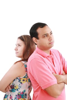 Young couple standing back to back having relationship difficulties on white background