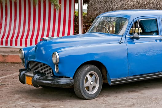 Vintage car shows signs of aging near Havana, Cuba.
