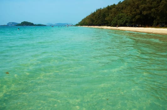 vibrant turquoise water on the seacoast. White sand sea and sun   ideal resort.