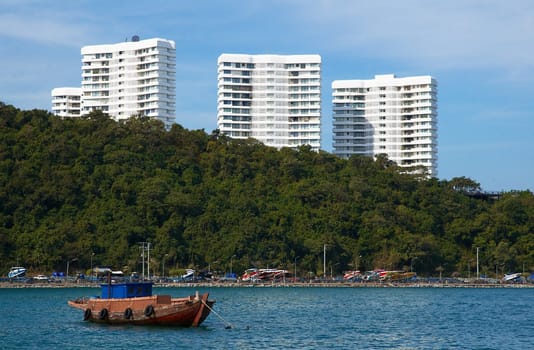 Boats, buildings, beach  modern seacoast urban landscape.
