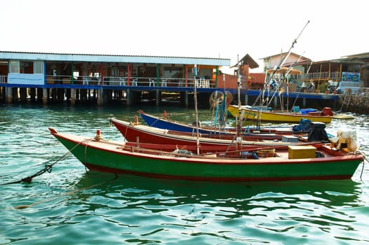 Boats, buildings, beach  seacoast urban landscape.