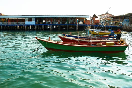 Boats, buildings, beach  seacoast urban landscape.