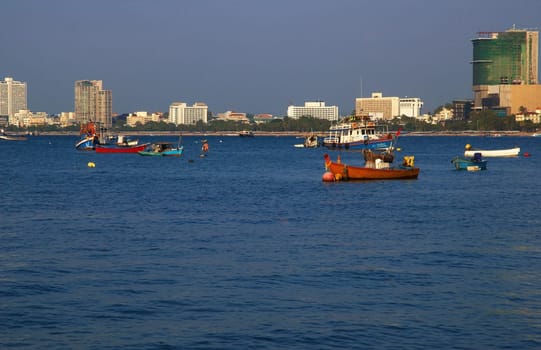 Boats, buildings, beach  modern seacoast urban landscape.