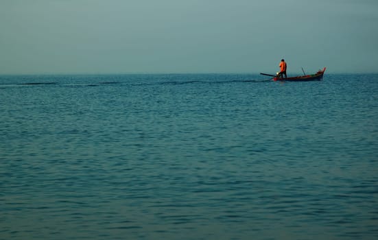 The only boat in the wide blue sea