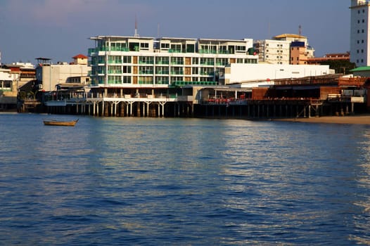 Boats, buildings, beach  modern seacoast urban landscape.