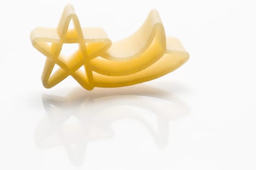 Christmas shooting stars noodle on white background with reflection