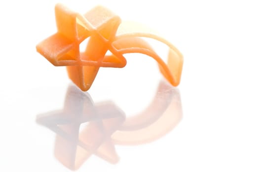 Christmas shooting stars noodle on white background with reflection