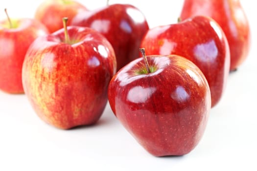 Delicious red aplles on white background