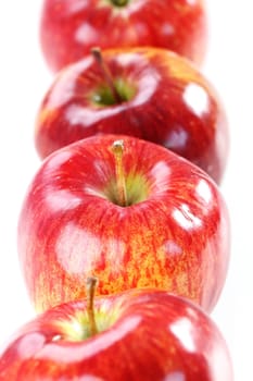 Delicious red aplles on white background