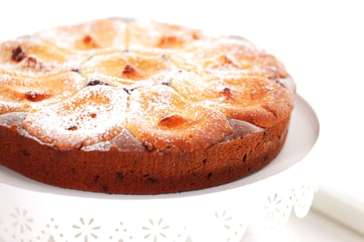 Delicious homemade apple cheesecake on white background