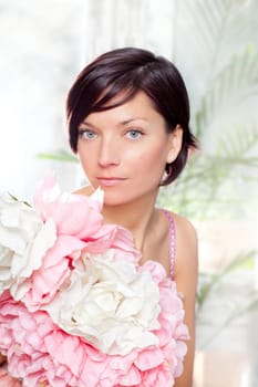 beautiful flowers woman with spring pink dress portrait