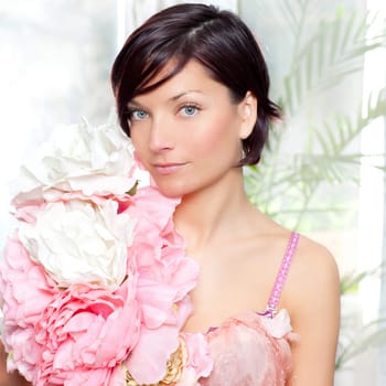 beautiful flowers woman with spring pink dress portrait