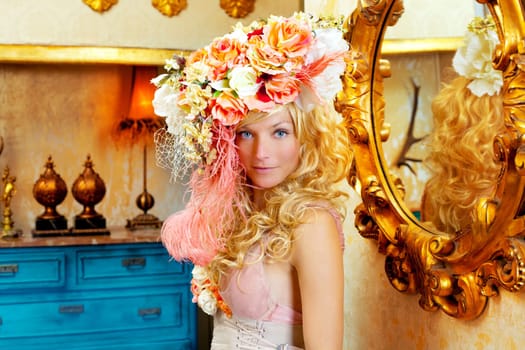 blond fashion woman with spring flowers hat in baroque grunge house