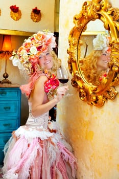 fashion baroque blond womand drinking red wine in grunge house