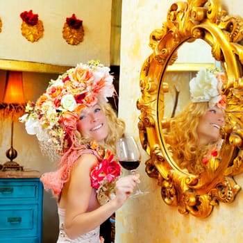 fashion baroque blond womand drinking red wine in grunge house