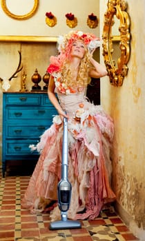 baroque fashion blonde housewife woman at vacuum cleaner chores