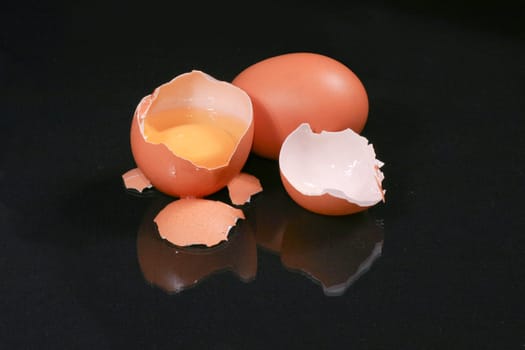 Egg and broken egg on the background