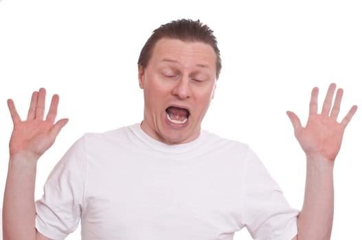 A European is frightened and holds his hands up and screams