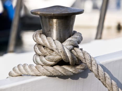steel bitt with ropes on the boat