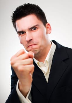 angry young business man close up shoot