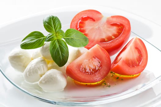 Tomato, mozzarella and fresh basil close up shoot