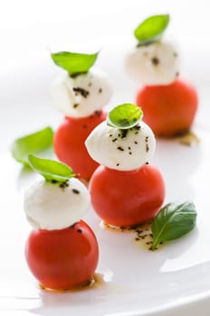 Fresh basil, tomato and mozzarella appetizer close up