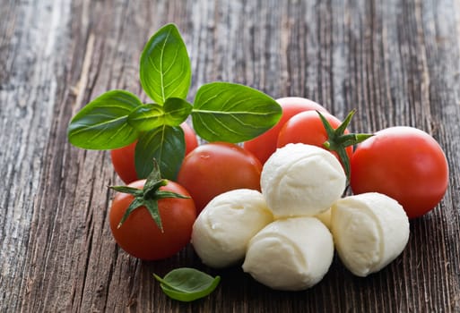 Mozzarella cheese, tomato and basil close up