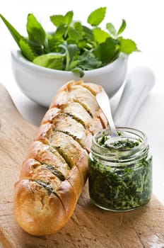 Freshly baked garlic bread with herbs close up