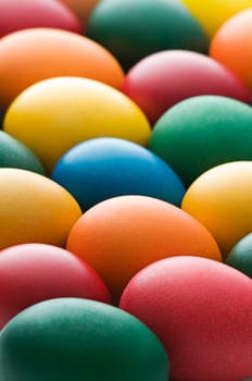 Colorful background made from easter eggs close up